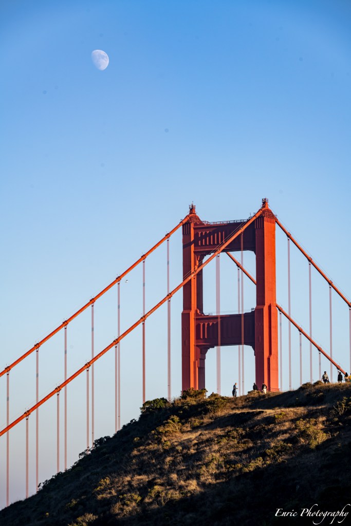Moon, people and bridge